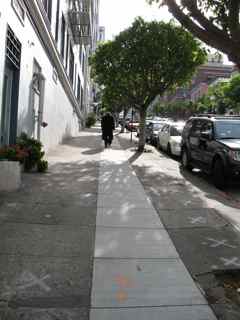 Man struggling up California St